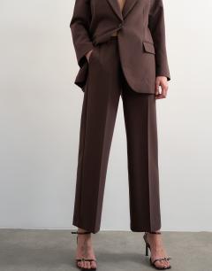 Model wearing Co ord mid rise clean straight trouser in chocolate