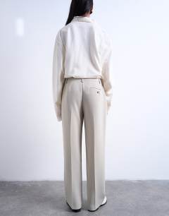 Model wearing Co ord mid rise clean straight trouser in stone