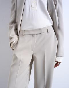 Model wearing Co ord mid rise clean straight trouser in stone