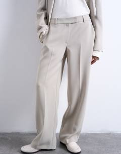 Model wearing Co ord mid rise clean straight trouser in stone