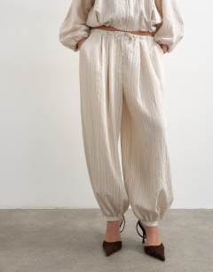 Model wearing Co ord modal balloon trouser in ivory stripe