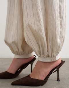 Model wearing Co ord modal balloon trouser in ivory stripe