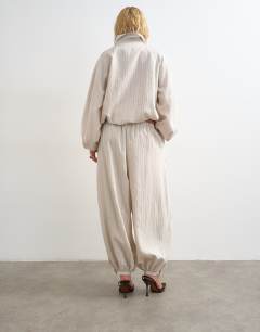 Model wearing Co ord modal balloon trouser in ivory stripe