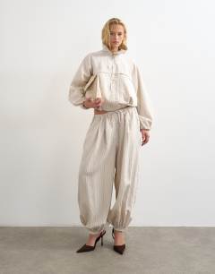 Model wearing Co ord modal jacket in ivory stripe