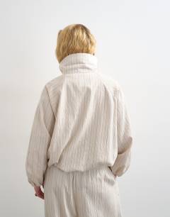 Model wearing Co ord modal jacket in ivory stripe
