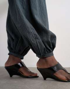 Model wearing Co ord modal stripe bubble hem trouser  in navy