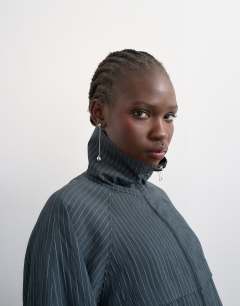 Model wearing Co ord modal stripe zip through jacket in navy