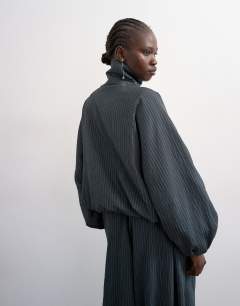 Model wearing Co ord modal stripe zip through jacket in navy