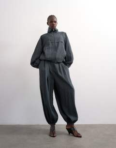 Model wearing Co ord modal stripe zip through jacket in navy