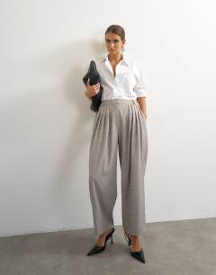 Model wearing Co ord  multi pleated wide leg trouser in taupe marl