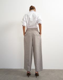 Model wearing Co ord  multi pleated wide leg trouser in taupe marl
