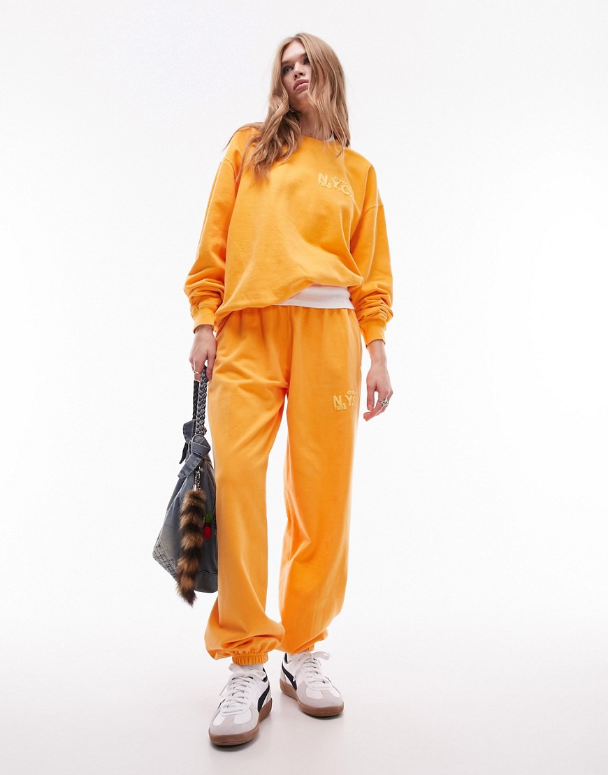 Topshop co-ord nyc project puff printed vintage wash oversized jogger in orange