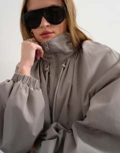 Model wearing Co ord nylon lightweight anorak jacket in grey