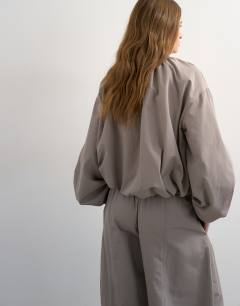 Model wearing Co ord nylon lightweight anorak jacket in grey