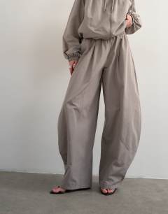 Model wearing Co ord nylon lightweight ovoid trouser in grey
