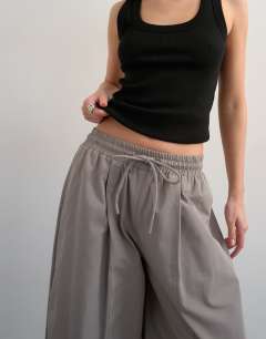 Model wearing Co ord nylon lightweight ovoid trouser in grey