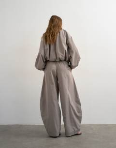 Model wearing Co ord nylon lightweight ovoid trouser in grey