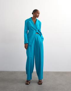 Model wearing Co ord occasion barrel trouser in turquoise