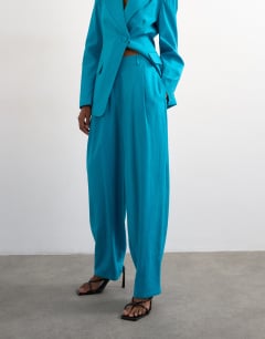 Model wearing Co ord occasion barrel trouser in turquoise