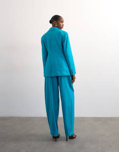 Model wearing Co ord occasion barrel trouser in turquoise