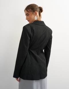 Model wearing Co ord occasion plisse tie waist blazer in black