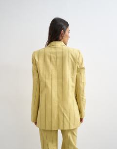 Model wearing Co ord occasion stripe blazer in yellow
