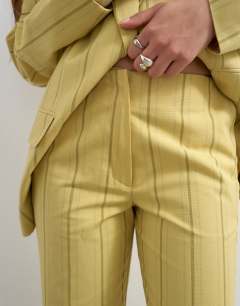 Model wearing Co ord occasion stripe clean front trouser in yellow