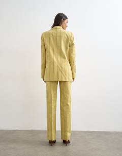 Model wearing Co ord occasion stripe clean front trouser in yellow