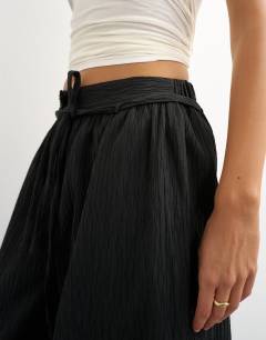 Model wearing Co ord occassion plisse balloon tie front trouser in black