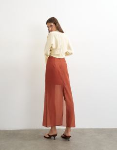 Model wearing Co-ord organza column maxi skirt in rust