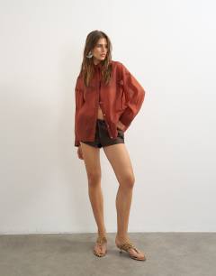 Model wearing Co-ord organza shirt in rust