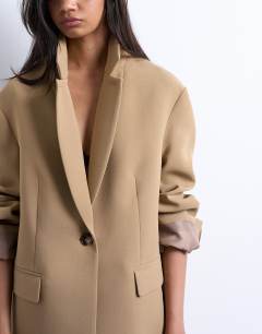 Model wearing Co ord oversized slouchy blazer in taupe