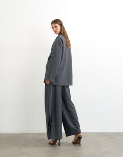 Model wearing Co ord ovoid side pleat trouser in grey