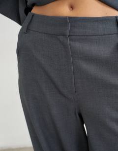 Model wearing Co ord ovoid side pleat trouser in grey