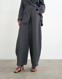 Model wearing Co ord ovoid side pleat trouser in grey