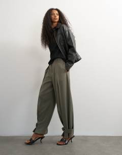 Model wearing Co ord ovoid tab hem tailored trouser in stone