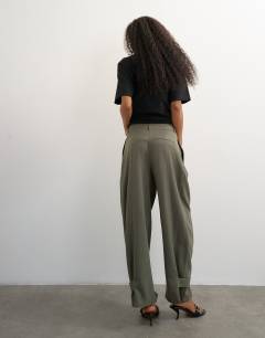Model wearing Co ord ovoid tab hem tailored trouser in stone