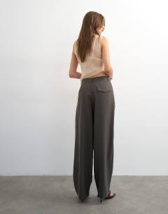 Model wearing Co ord pleated mid rise trouser in charcoal