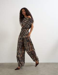 Model wearing Co ord pleated trouser in check