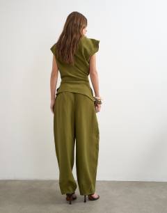 Model wearing Co ord pleated trouser in khaki