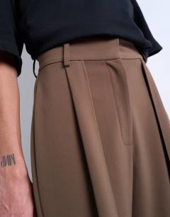 Model wearing Co ord pleated volume trouser in mushroom