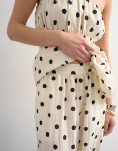 Model wearing Co ord polka dot balloon trouser in white