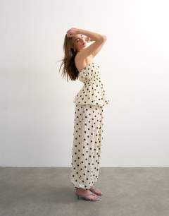 Model wearing Co ord polka dot balloon trouser in white
