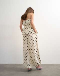 Model wearing Co ord polka dot balloon trouser in white