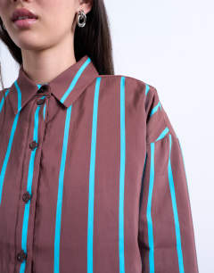 Model wearing Co-ord quilted oversized stripe shirt