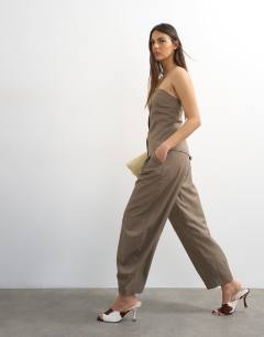 Model wearing Co ord raw hem barrel leg tailored trouser in brown