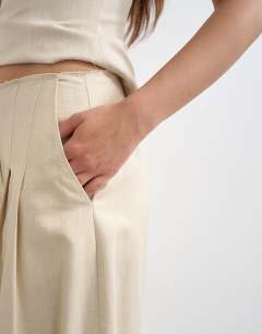 Model wearing Co ord raw hem barrel  leg tailored trouser in stone