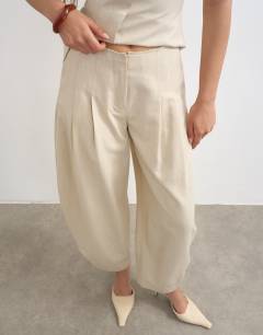 Model wearing Co ord raw hem barrel  leg tailored trouser in stone