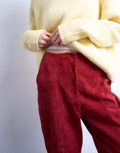 Model wearing Co ord real suede flare trousers in red