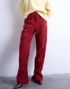 Model wearing Co ord real suede flare trousers in red